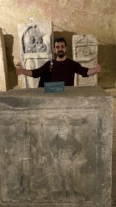 Tour guide showing how DJs used ancient stelae at parties in Belgrade