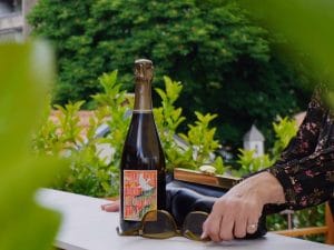 chilled champagne bottle on terrace with greenery in belgrade